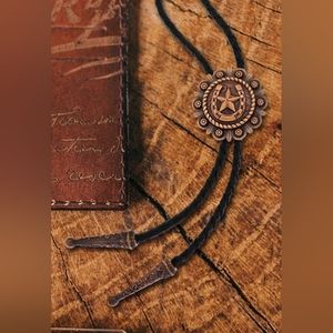New copper horshoe star leather bolo tie approximately 40".  Silver or copper
